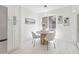 Cozy dining area with a round table, modern chairs, and ample natural light at 13934 Clubhouse Cir # 8, Tampa, FL 33618