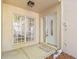 Charming front entrance with large window, glass door, and inviting welcome mat at 13934 Clubhouse Cir # 8, Tampa, FL 33618