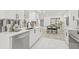 Kitchen features white cabinetry, stainless steel appliances, and an adjacent dining area at 13934 Clubhouse Cir # 8, Tampa, FL 33618