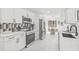 Modern kitchen with stainless steel appliances, white cabinets, and an adjacent dining area at 13934 Clubhouse Cir # 8, Tampa, FL 33618