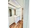 Well-lit bathroom with a modern vanity, large mirror, and convenient access to the shower and toilet at 141 Lakeside Dr, Oldsmar, FL 34677