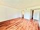 An empty bedroom with wood-look flooring, neutral walls, and a closet ready for personalization at 141 Lakeside Dr, Oldsmar, FL 34677