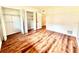 Bedroom features wood floors, white walls, and closet at 141 Lakeside Dr, Oldsmar, FL 34677