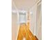 Bright hallway with wood floors, neutral walls, and a closet, leading to the unit's living spaces at 141 Lakeside Dr, Oldsmar, FL 34677