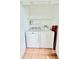 Laundry room with washer, dryer, and shelving at 141 Lakeside Dr, Oldsmar, FL 34677