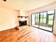 Bright living room with fireplace and screened patio at 141 Lakeside Dr, Oldsmar, FL 34677