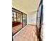 Screened-in patio with tile floors and a view of the pond at 141 Lakeside Dr, Oldsmar, FL 34677