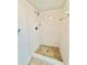 Updated shower featuring tiled walls and flooring, offering a clean and functional space in the bathroom at 141 Lakeside Dr, Oldsmar, FL 34677