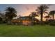 Expansive backyard featuring a pool, palms, and a fountain - perfect for entertaining at 17129 Breeders Cup Dr, Odessa, FL 33556