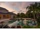 Resort-style pool and hot tub with rock features and ample space for entertaining friends and Gathering at 17129 Breeders Cup Dr, Odessa, FL 33556