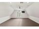 Bonus room with plush carpet, fan, and arched window offering plenty of natural light at 17129 Breeders Cup Dr, Odessa, FL 33556