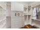 Custom walk-in closet with ample shelving and drawers at 17129 Breeders Cup Dr, Odessa, FL 33556