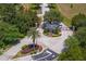 Beautiful gated community entrance with lush landscaping and signage for residents and visitors at 17129 Breeders Cup Dr, Odessa, FL 33556