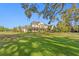 Stunning home with expansive lawn and garden showcasing beautiful landscaping and curb appeal at 17129 Breeders Cup Dr, Odessa, FL 33556
