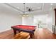 Spacious game room with a pool table and custom lighting, perfect for entertainment at 17129 Breeders Cup Dr, Odessa, FL 33556