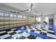 Spacious garage featuring a black and white checkerboard floor and ample storage at 17129 Breeders Cup Dr, Odessa, FL 33556