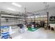 Spacious garage with ample storage shelving and room for equipment at 17129 Breeders Cup Dr, Odessa, FL 33556
