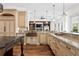 Expansive kitchen featuring custom cabinetry, granite countertops, and built-in appliances at 17129 Breeders Cup Dr, Odessa, FL 33556