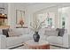 Bright and spacious living room with comfortable sectional seating and stylish decor at 17129 Breeders Cup Dr, Odessa, FL 33556