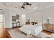 Spacious main bedroom with tray ceilings, hardwood floors, and stylish decor at 17129 Breeders Cup Dr, Odessa, FL 33556