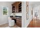 Bright office area featuring built-in shelves, cabinets, and drawers at 17129 Breeders Cup Dr, Odessa, FL 33556