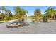 Backyard with luxurious pool and spa with stone detailing with surrounding patio at 17129 Breeders Cup Dr, Odessa, FL 33556