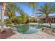 Lush landscaping surrounds a stunning pool at 17129 Breeders Cup Dr, Odessa, FL 33556