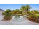 Backyard pool area surrounded by tropical landscaping at 17129 Breeders Cup Dr, Odessa, FL 33556
