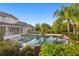 Scenic backyard pool area with home in background at 17129 Breeders Cup Dr, Odessa, FL 33556