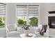 Comfortable sitting area with neutral colors, natural lighting, and views of the backyard at 17129 Breeders Cup Dr, Odessa, FL 33556
