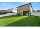 Spacious backyard featuring manicured lawn and white vinyl fence that provides privacy at 1726 Hadden Hall Pl, Trinity, FL 34655