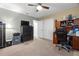 Bright bedroom features carpeted floors, ceiling fan, and a functional desk area at 1726 Hadden Hall Pl, Trinity, FL 34655