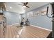 Bonus room with wood-look flooring, airplane decor, and exercise equipment at 1726 Hadden Hall Pl, Trinity, FL 34655