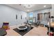 Carpeted bonus room with work out equipment and large mirror at 1726 Hadden Hall Pl, Trinity, FL 34655