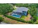 An elevated perspective of the neighborhood with a private pool and a large yard at 18107 Sugar Brooke Dr, Tampa, FL 33647
