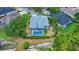 This aerial view reveals a private backyard pool, screened-in patio, and well-maintained yard at 18107 Sugar Brooke Dr, Tampa, FL 33647