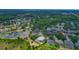 Aerial view highlights a screened-in pool and the surrounding residential neighborhood at 18107 Sugar Brooke Dr, Tampa, FL 33647