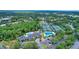 An aerial view showcasing community amenities including a pool, tennis courts, clubhouse, and lush landscaping at 18107 Sugar Brooke Dr, Tampa, FL 33647