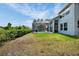 A well-maintained backyard features a screened-in pool and lush greenery at 18107 Sugar Brooke Dr, Tampa, FL 33647