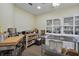 Large bonus room featuring a custom shelving and stainless steel workspaces at 18107 Sugar Brooke Dr, Tampa, FL 33647