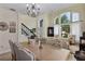 Traditional dining area boasts an elegant chandelier and an open layout at 18107 Sugar Brooke Dr, Tampa, FL 33647