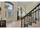 Bright foyer boasts tall ceilings and an elegant front door with sidelights at 18107 Sugar Brooke Dr, Tampa, FL 33647