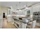 Gourmet kitchen featuring an oversized island, stainless steel appliances, and ample cabinet space for storage at 18107 Sugar Brooke Dr, Tampa, FL 33647