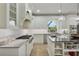 Gourmet kitchen featuring stainless steel appliances, a center island and white cabinetry at 18107 Sugar Brooke Dr, Tampa, FL 33647