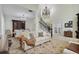 Bright open-concept living area features a chandelier and adjacent dining area at 18107 Sugar Brooke Dr, Tampa, FL 33647