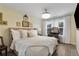Comfortable main bedroom with a bed, windows, and dark hardwood floors at 18107 Sugar Brooke Dr, Tampa, FL 33647