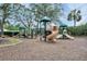 A spacious and colorful outdoor playground with slides and climbing structures for community enjoyment at 18107 Sugar Brooke Dr, Tampa, FL 33647