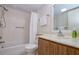 Bathroom featuring an updated vanity, modern fixtures, and a shower with a tub at 19029 Us Highway 19 N # 31F, Clearwater, FL 33764