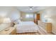 Bright bedroom featuring a king-sized bed, ceiling fan, and scenic views from the window at 19029 Us Highway 19 N # 31F, Clearwater, FL 33764
