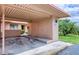Covered carport with designated parking spots and extra storage closets in a condominium community at 19029 Us Highway 19 N # 31F, Clearwater, FL 33764